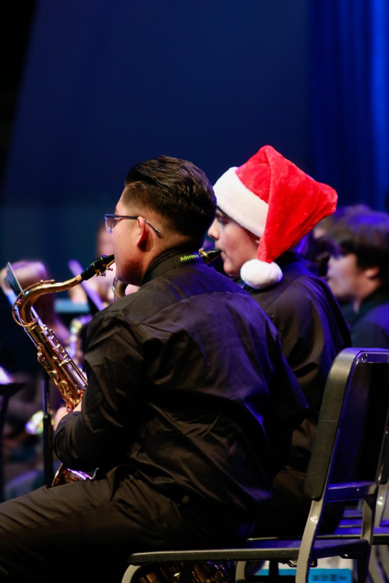 Students Playing their instrument for winter band concert. 