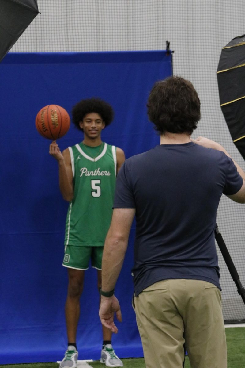 Basketball player poses for photo.