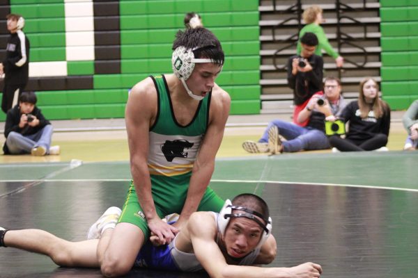 Navigation to Story: Boys Wrestling vs. Kapaun (Photos by Ella Davidson)