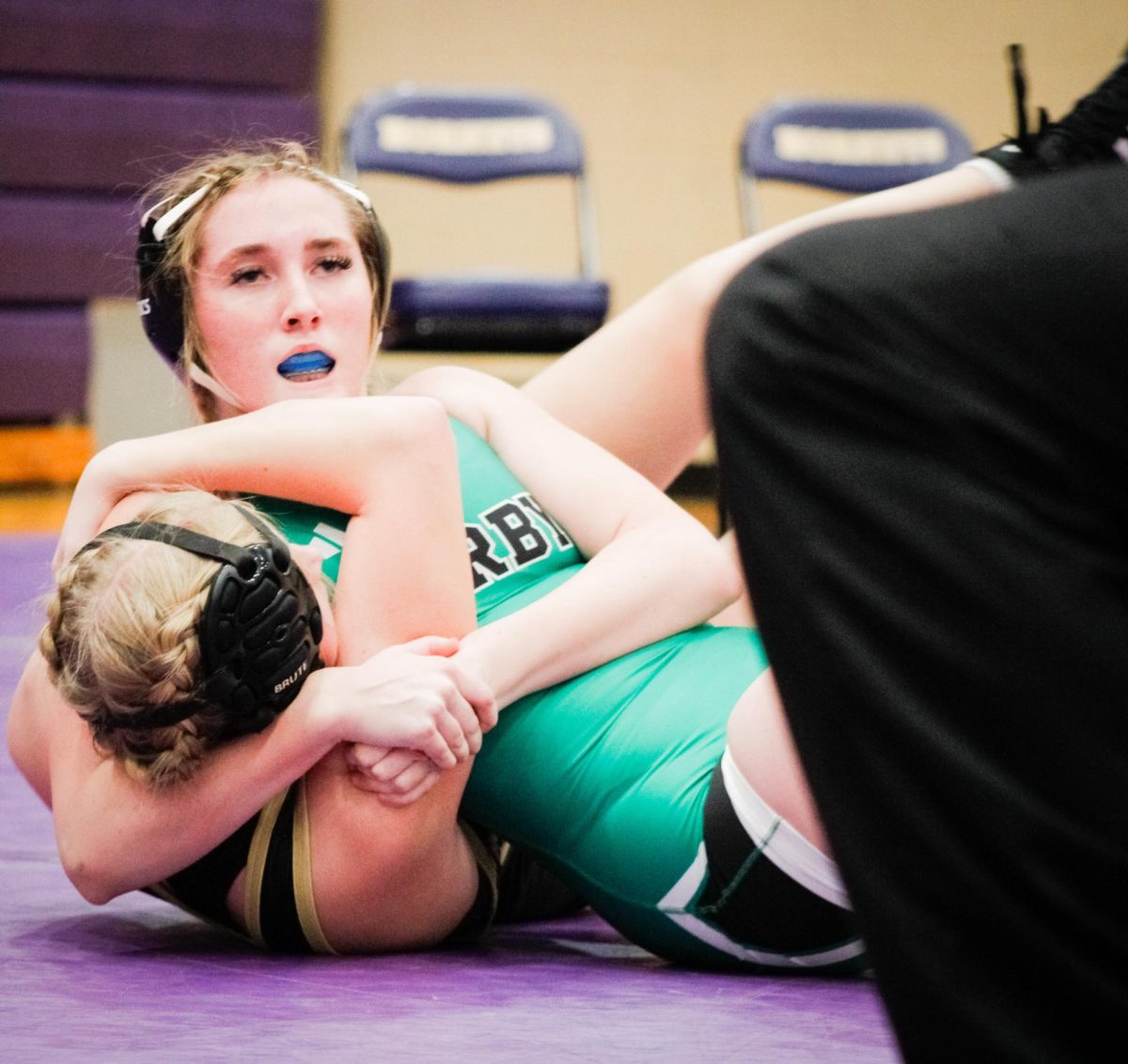 Junior Madison Miller puts her opponent in a headlock.