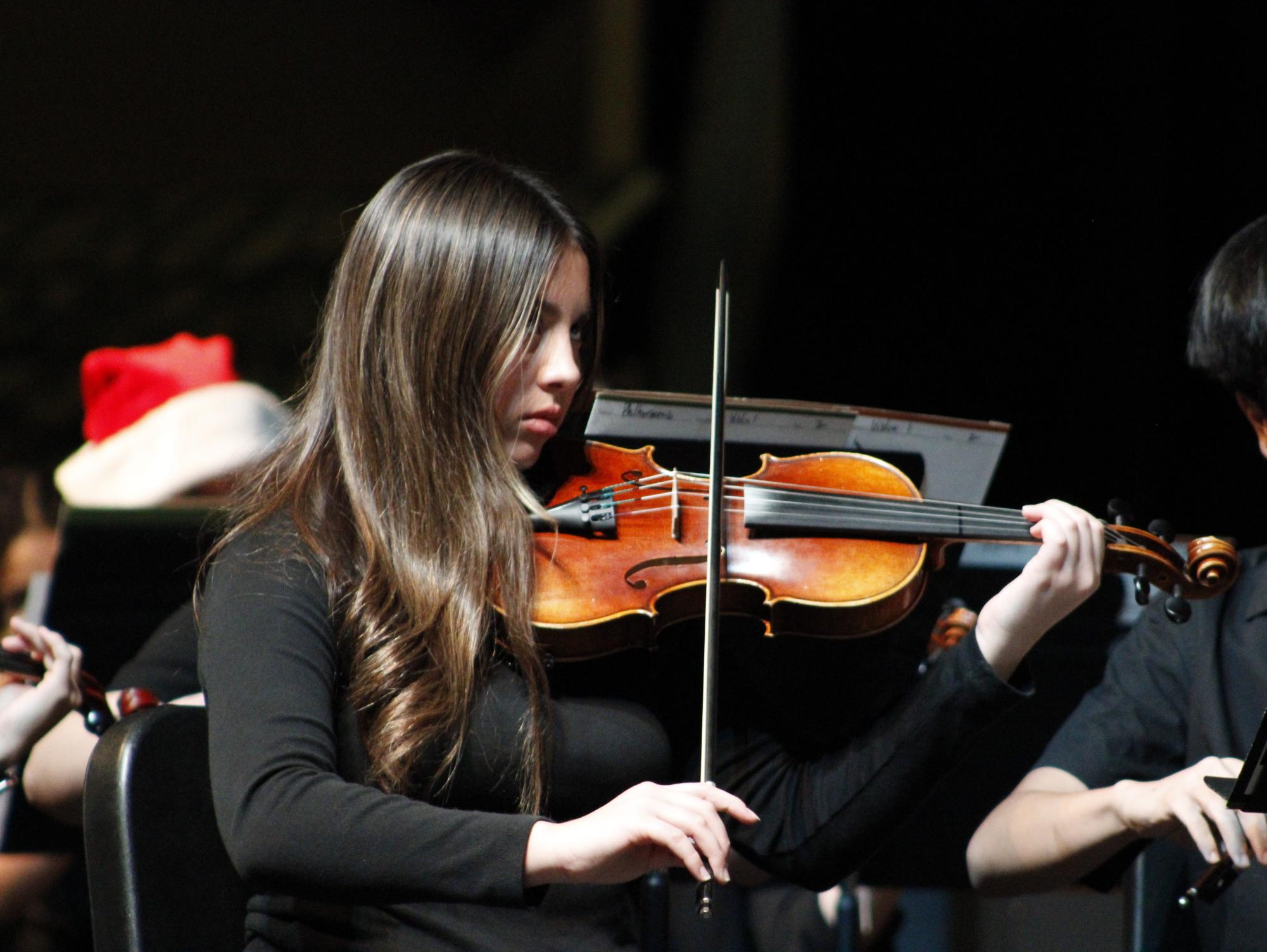 Orchestra member looks up during a song