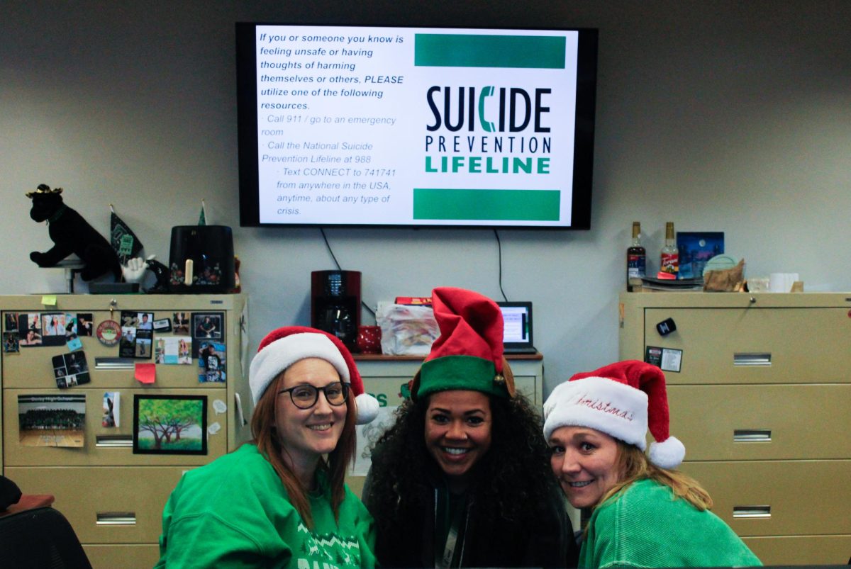 Derby High School staff wearing Santa hats for today.