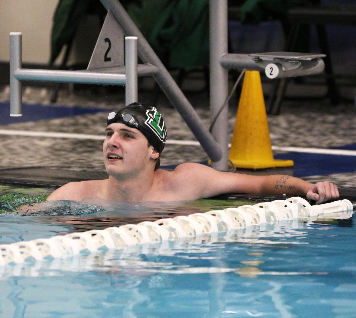 Senior Jared Hays smiles as he looks up at his time of 2:19.62 after competing in the 200-yard individual medley.