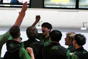 DHS varsity bowling team celebrates its victory at the season's opening Baker tournament, finishing first with a total of 2,793 pins, beating second-place Campus High School by 34 pins.