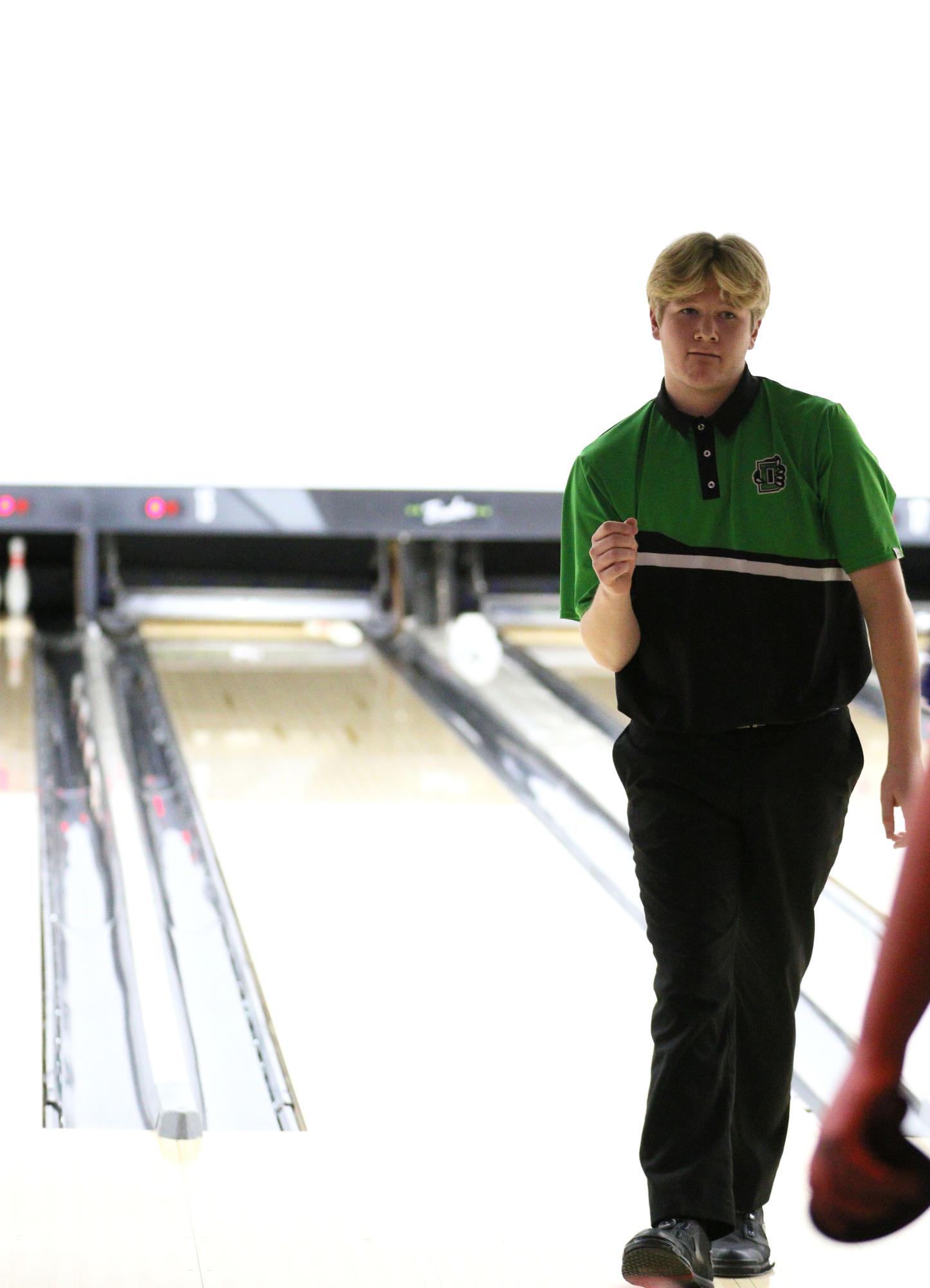 Junior Cash Carns celebrates after rolling a strike in the first frame.