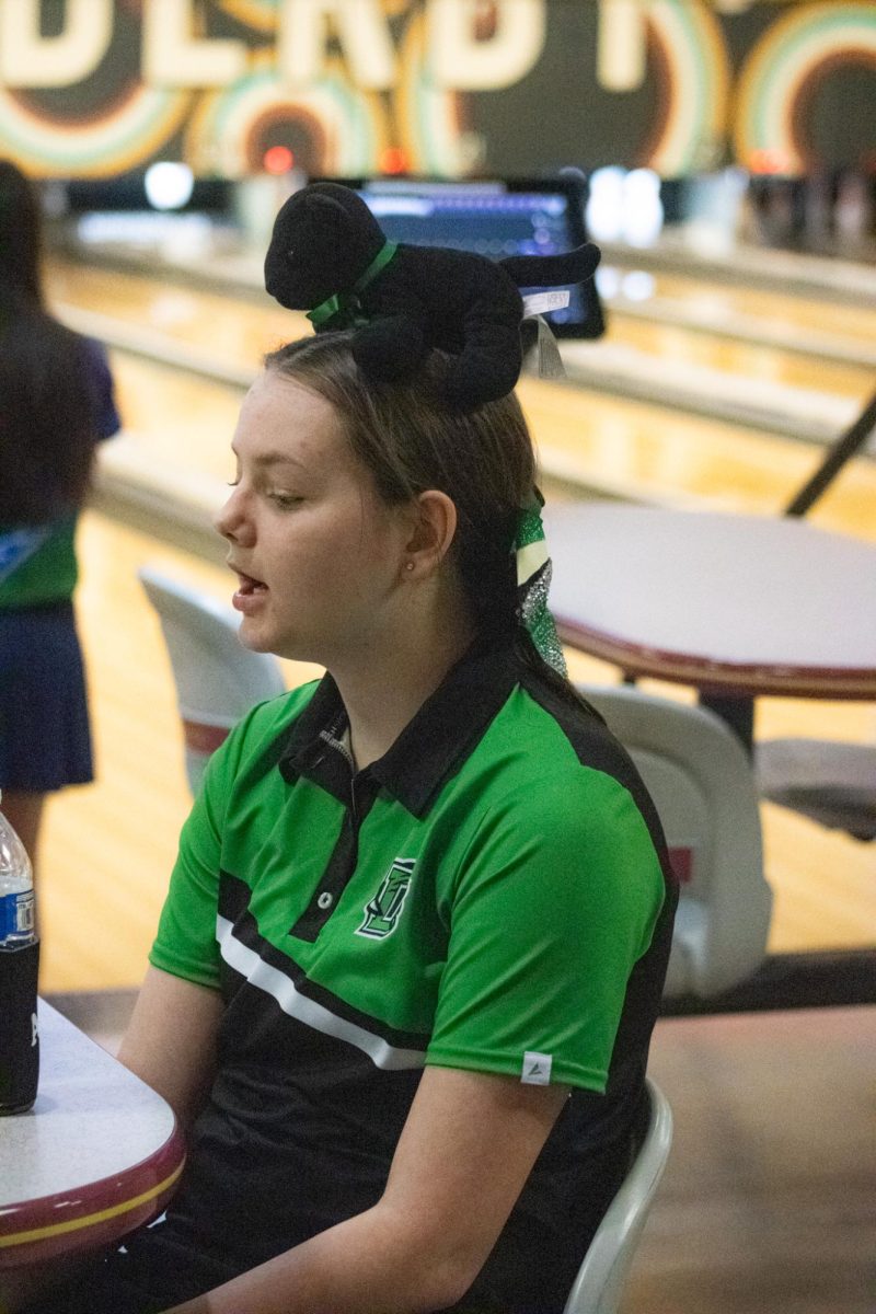 Bowler ,senior Aleah Jones, talks with teammates. 