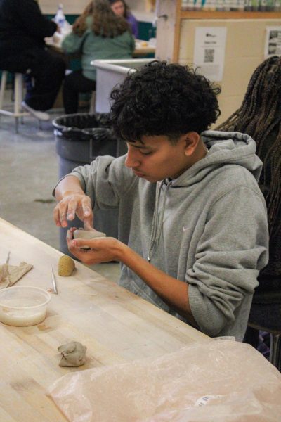 Student forms shape of a Ocarina.