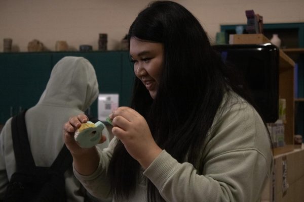 Students make their clay whistles during the class period.