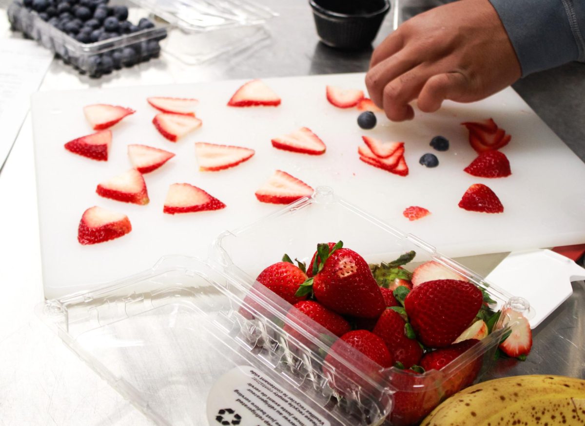 Strawberries are cut up. 