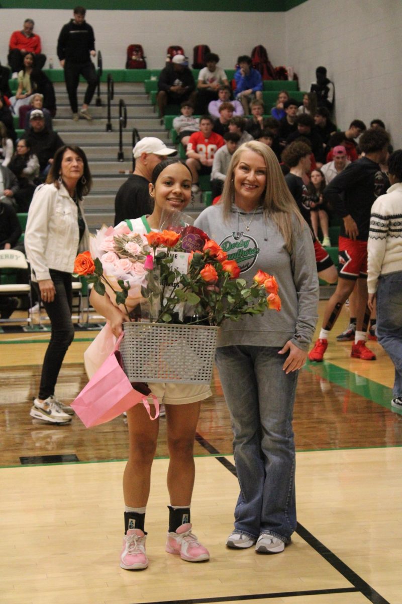 Senior smiles with her mom