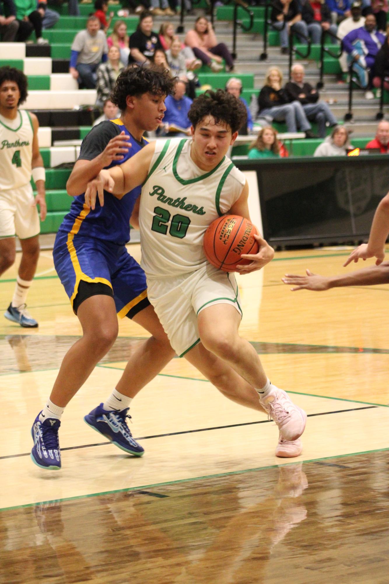 Varsity Boys Basketball vs. Hutchinson (Photos by Kaelyn Kissack)