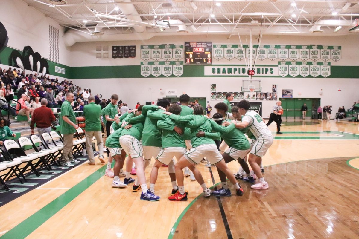 Players in a huddle before the game 