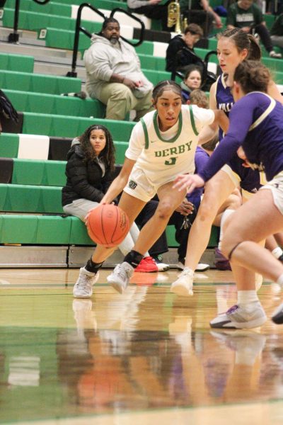 Freshman Aysia Fox Dribbles the ball