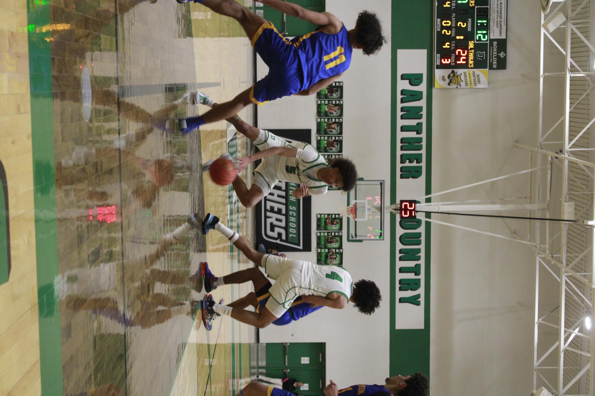 Varsity Boys basketball vs. Hutchinson (Photos by Tripp Stratton)