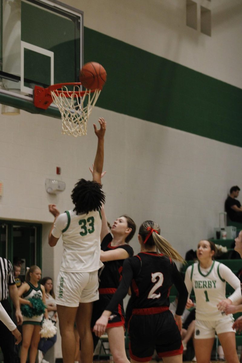 Junior Makayla Askew,  attempts a dunk. 