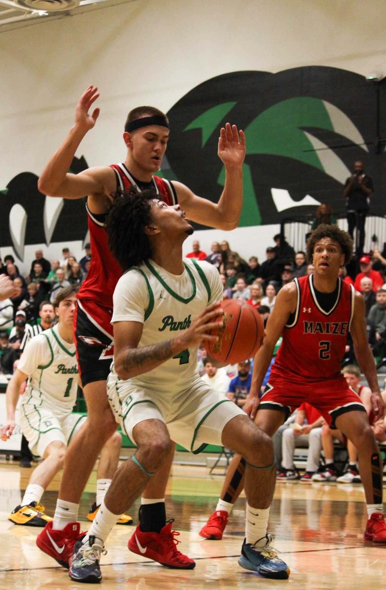 Varsity boys basketball vs. Maize (Photos by Betsy Ordinan)