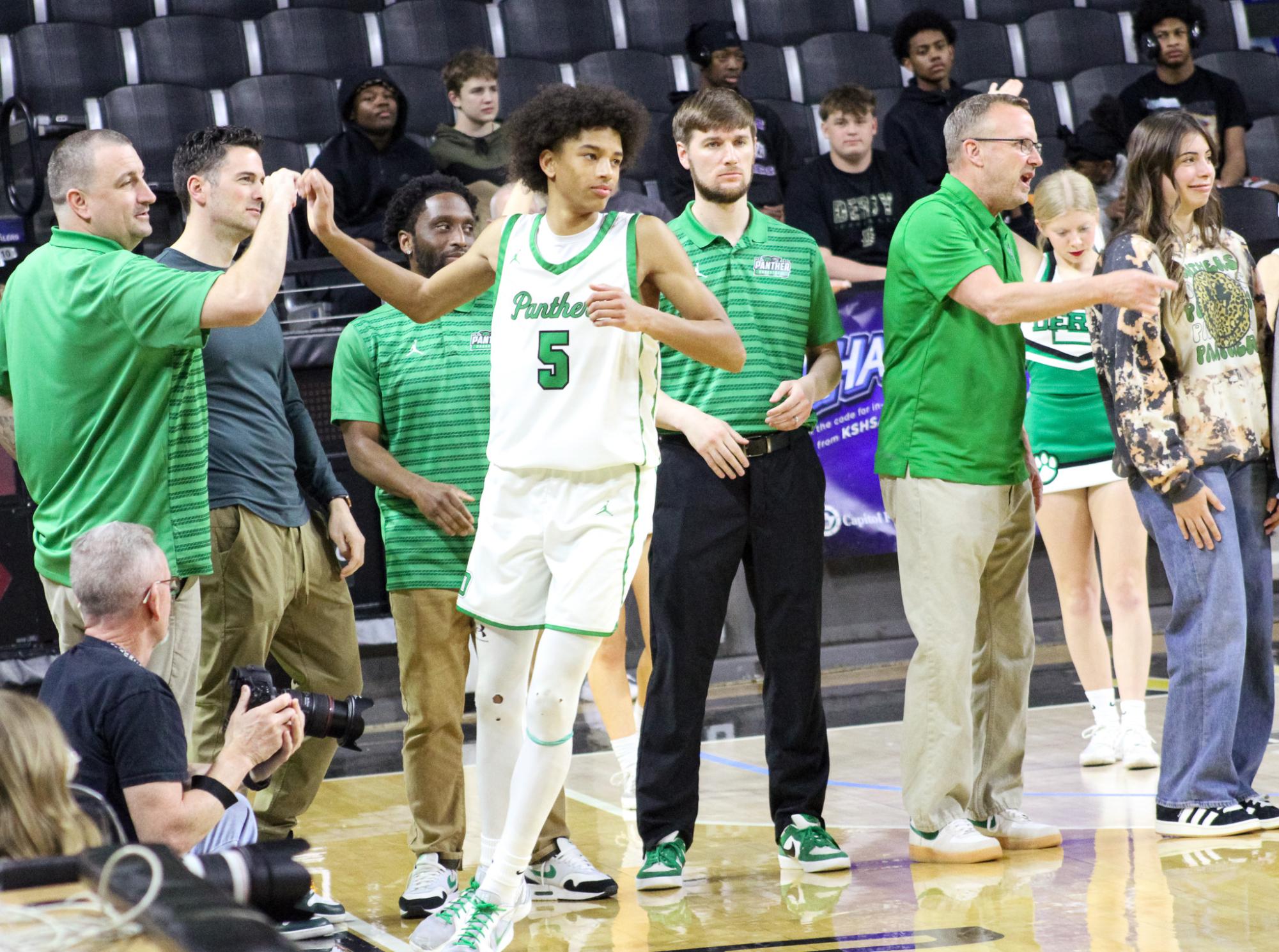 Boys basketball state playoffs vs. Olathe North (Photos by Ava Mbawuike)