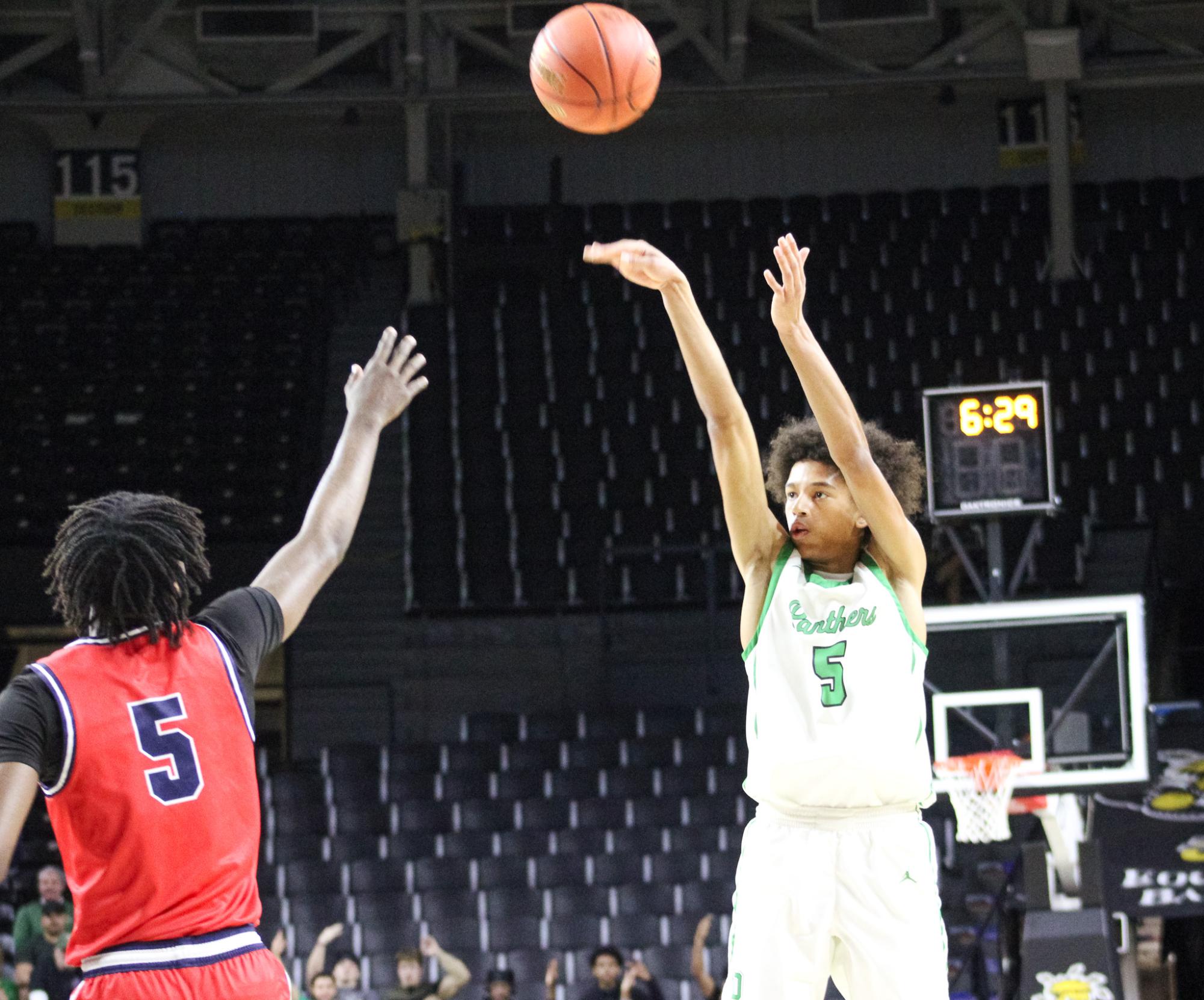 Boys basketball state playoffs vs. Olathe North (Photos by Ava Mbawuike)