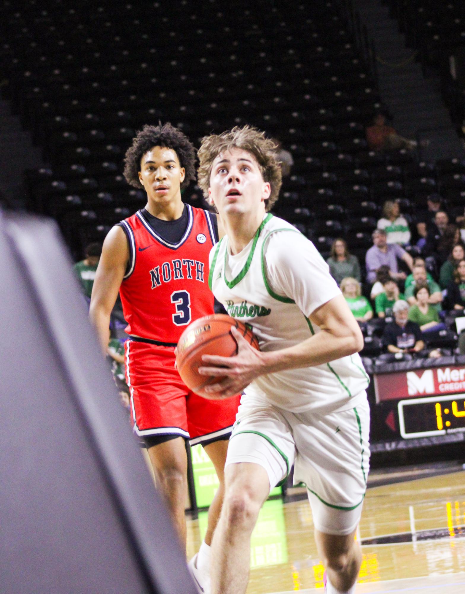 Boys basketball state playoffs vs. Olathe North (Photos by Ava Mbawuike)