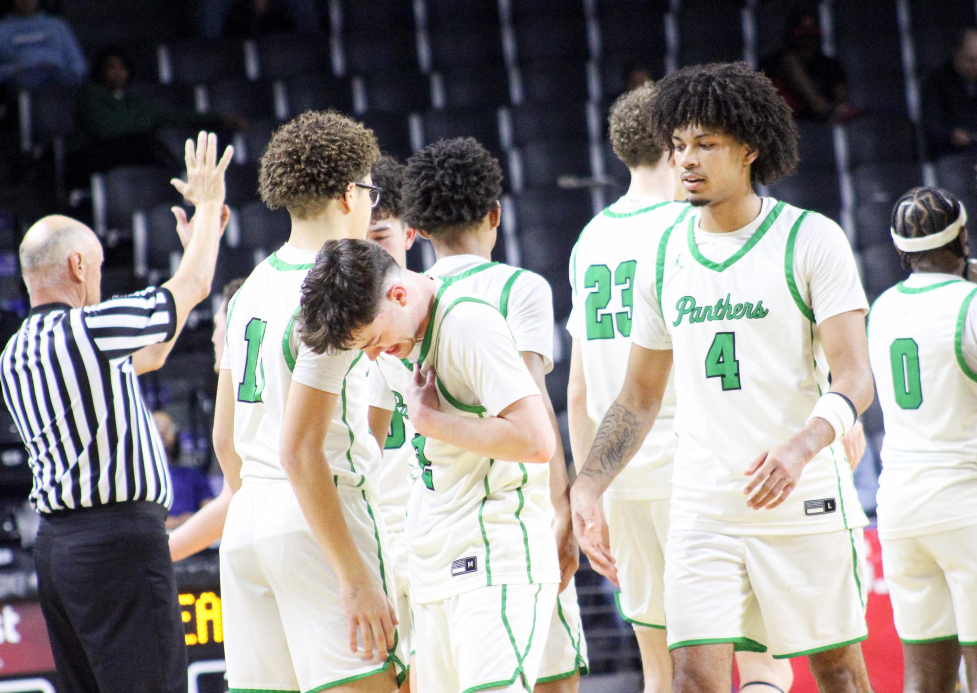 Boys basketball state playoffs vs. Olathe North (Photos by Ava Mbawuike)