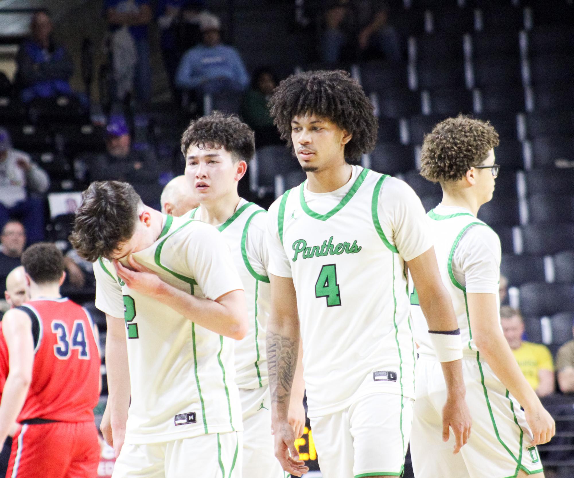 Boys basketball state playoffs vs. Olathe North (Photos by Ava Mbawuike)