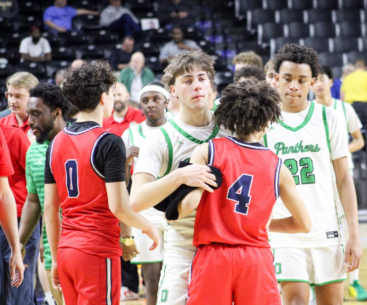 Derby players hug Olathe North players after their loss. 