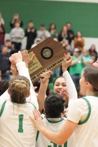 Girls basketball team celebrating their 74-33 win over Garden City for the sub-state title.