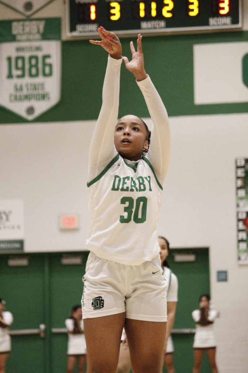 Player's hands come back down after they shoot the ball.