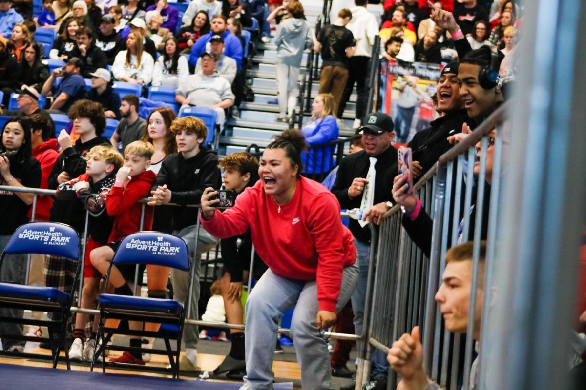 Senior Bryley Davis and the crowd watch the match excitedly.