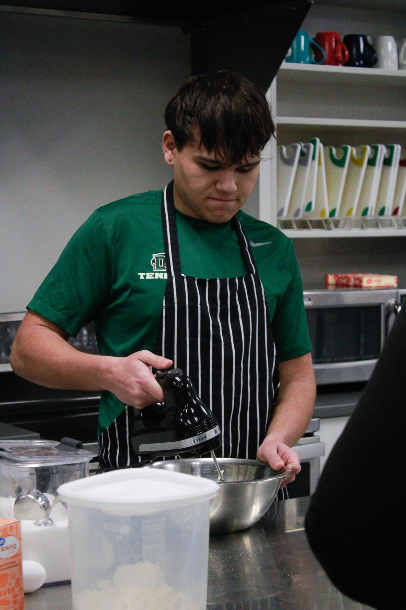 Student bakes snickerdoodle cookies.