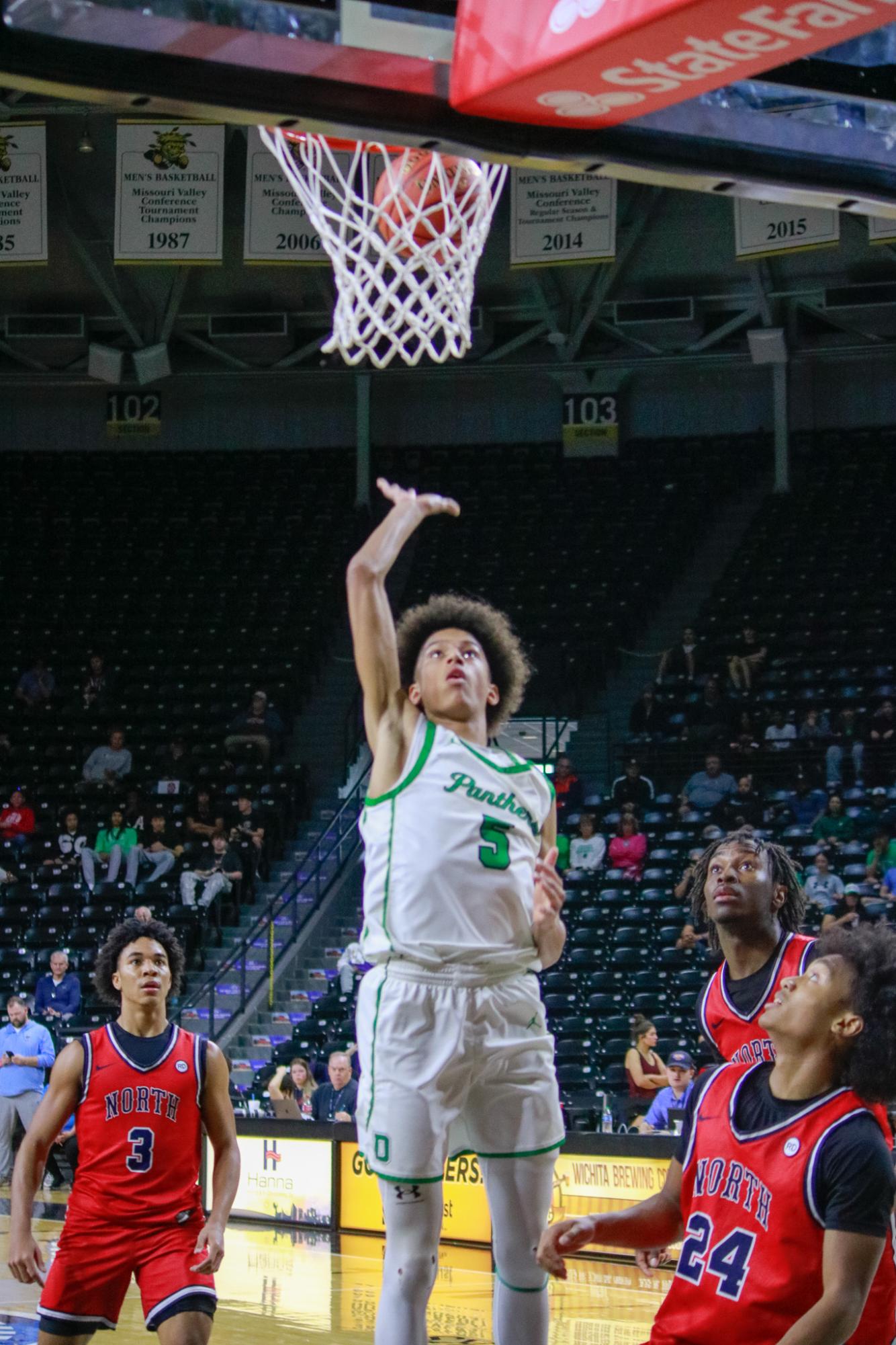 Boys varsity basketball vs. Olathe North (Photos by Persephone Ivy)