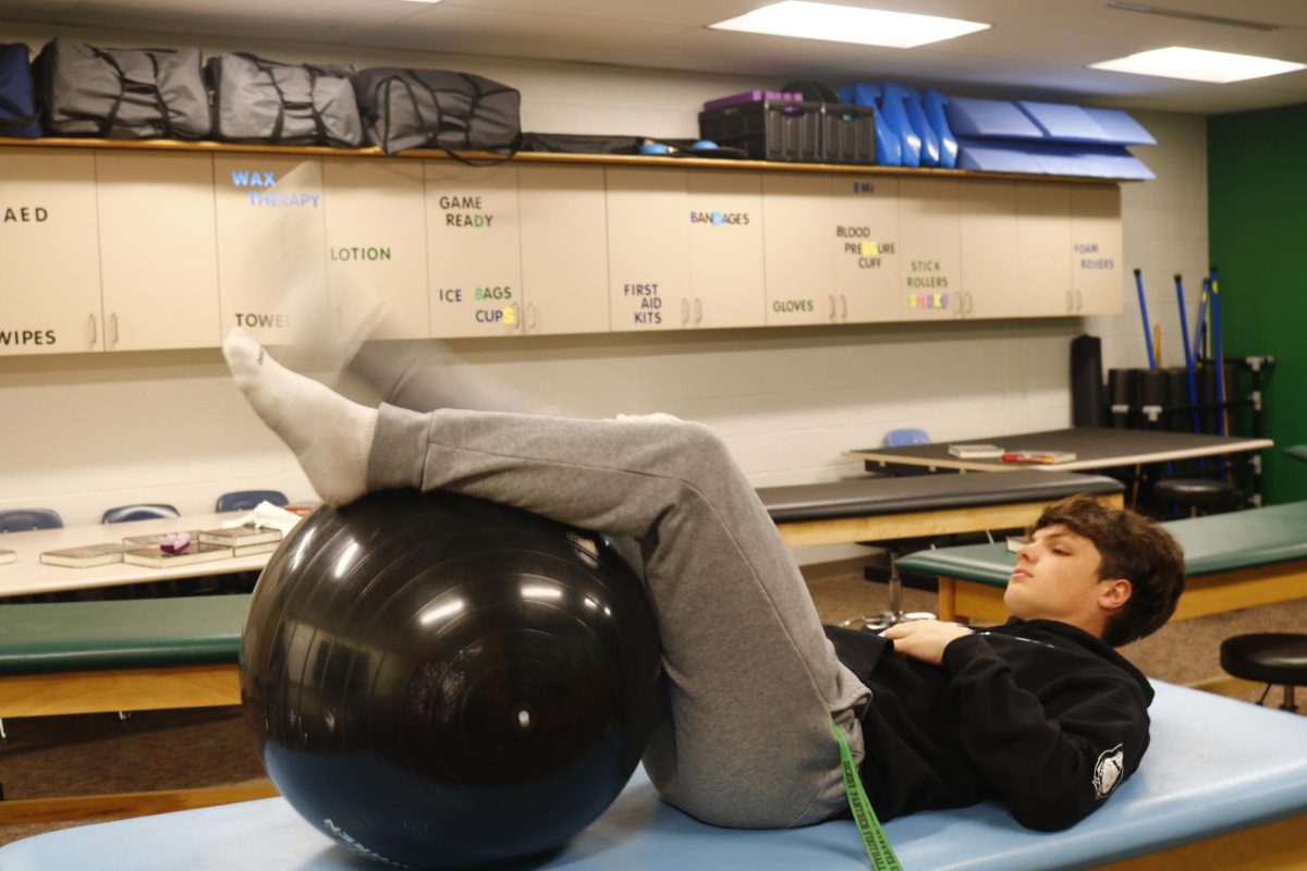 Junior, Issac Nicholas demonstrates stability ball exercise.