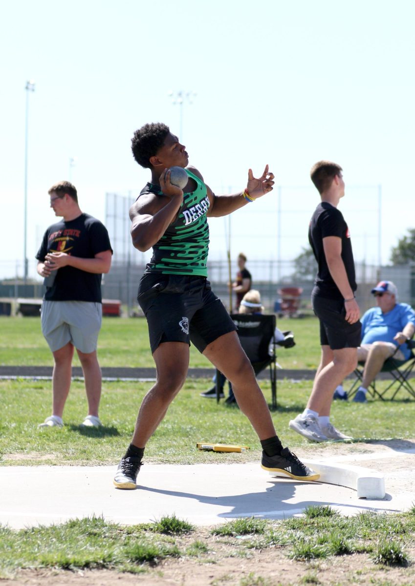 Senior Evian Curtis competes in the shot put.