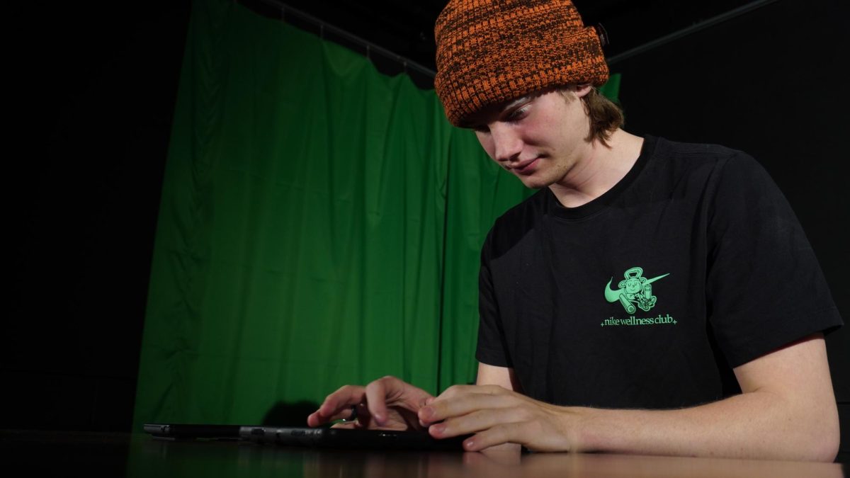 Junio Corbin Nelson Craig typing script on Ipad