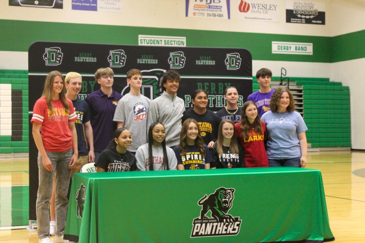 Students sign for their colleges.