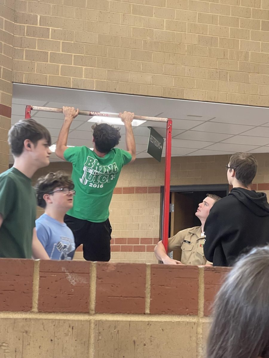 DHS students take on the pull up bar challenge.