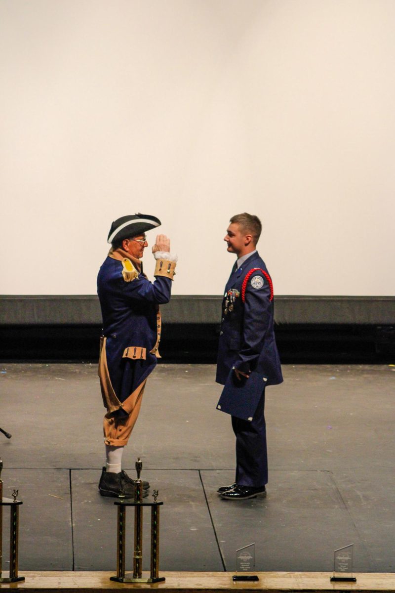 Members of AFJROTC receive awards.