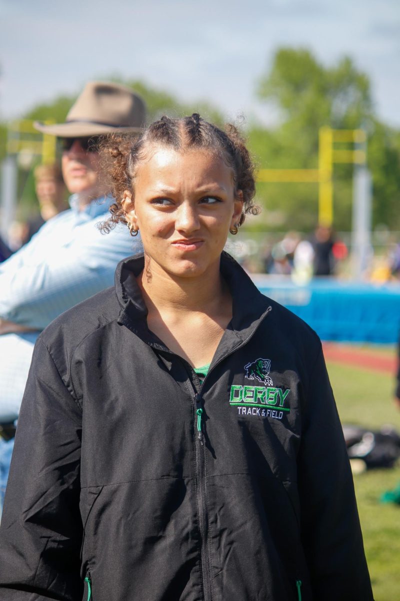 Student listens to coach.