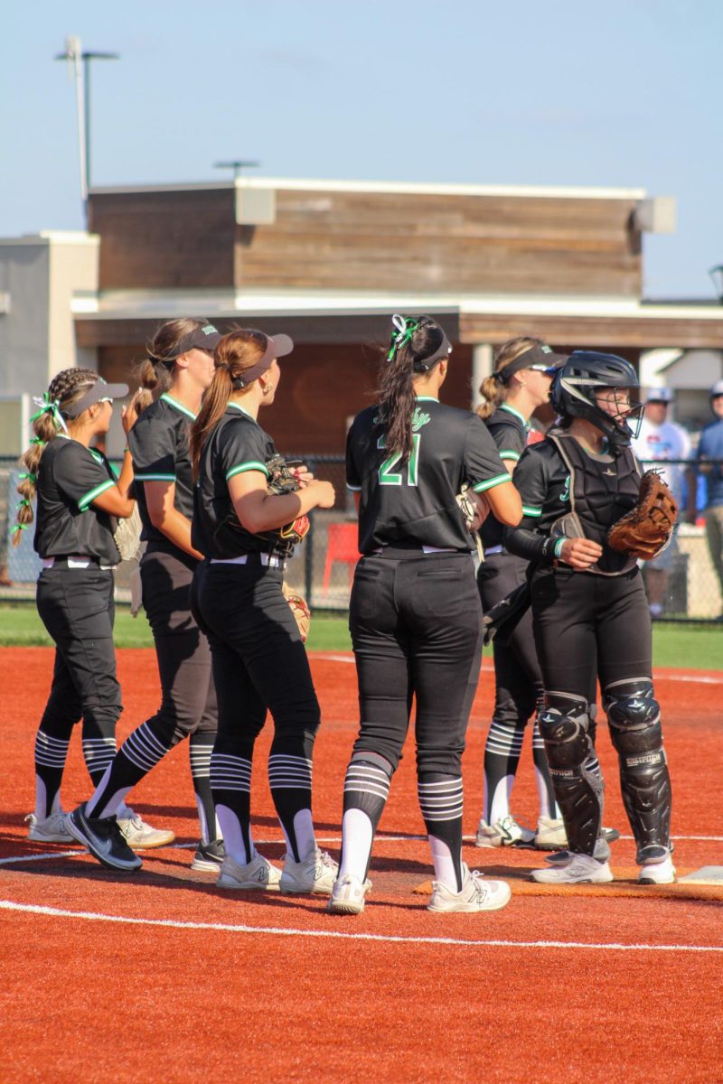 Infield has a team huddle in between innings.