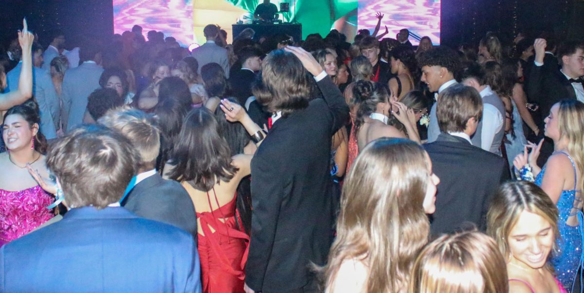 Students dance together.