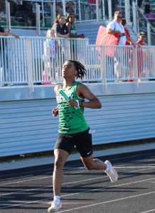 Student runs in a relay.