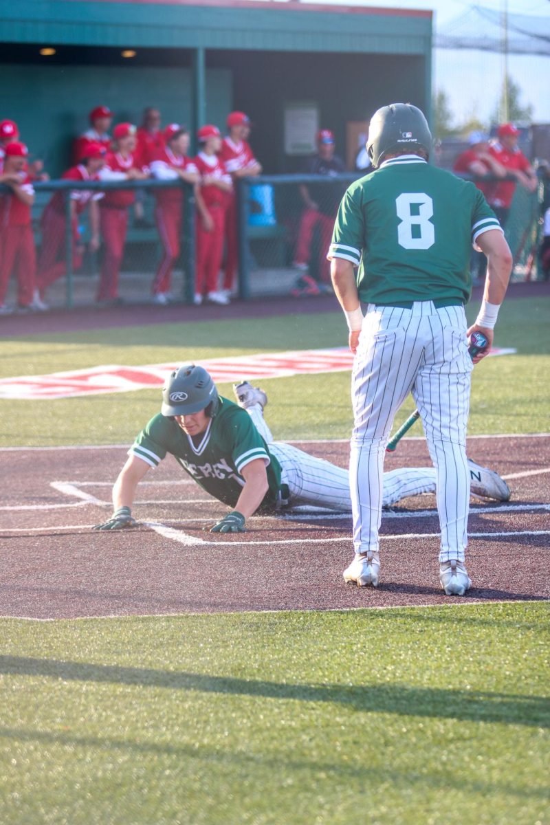 Junior Cooper Williams sliding into home 