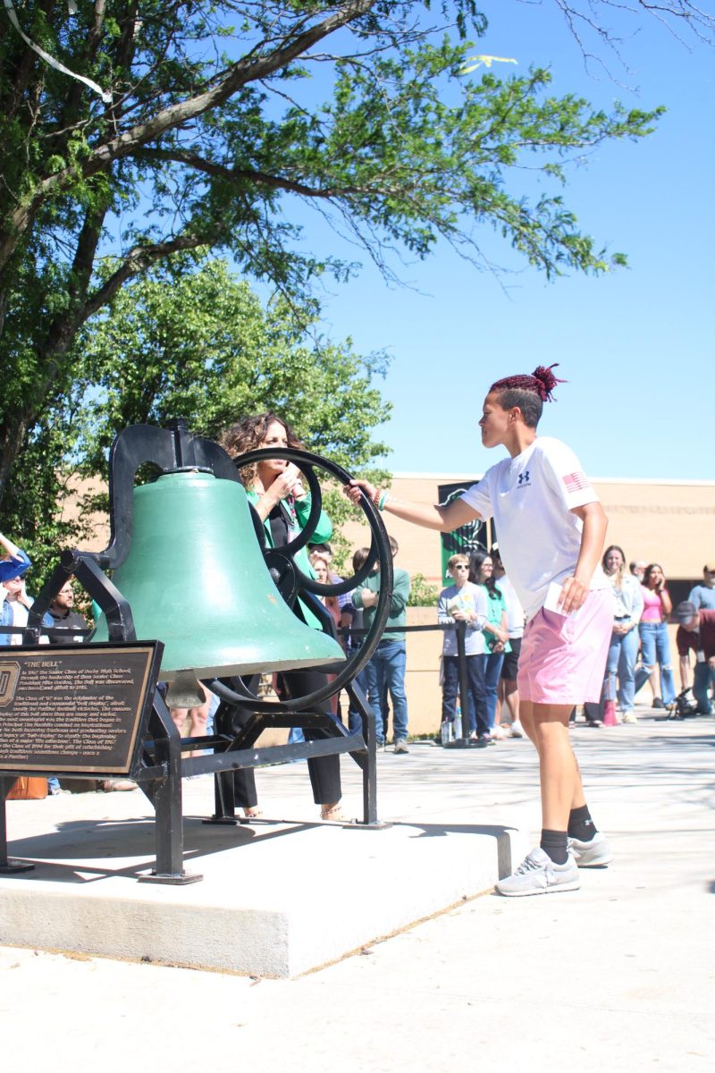 Seniors ring the bell as they leave.