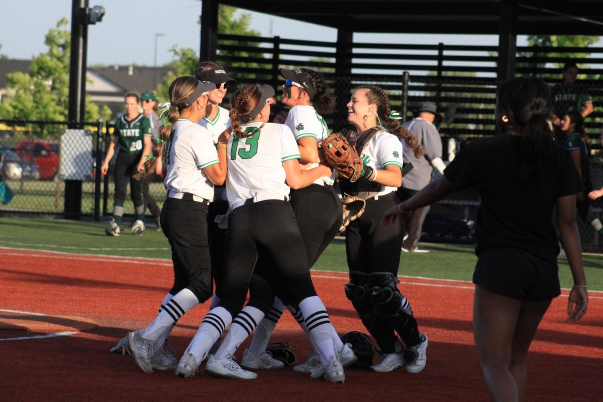 Players jump in happiness after winning the game. 