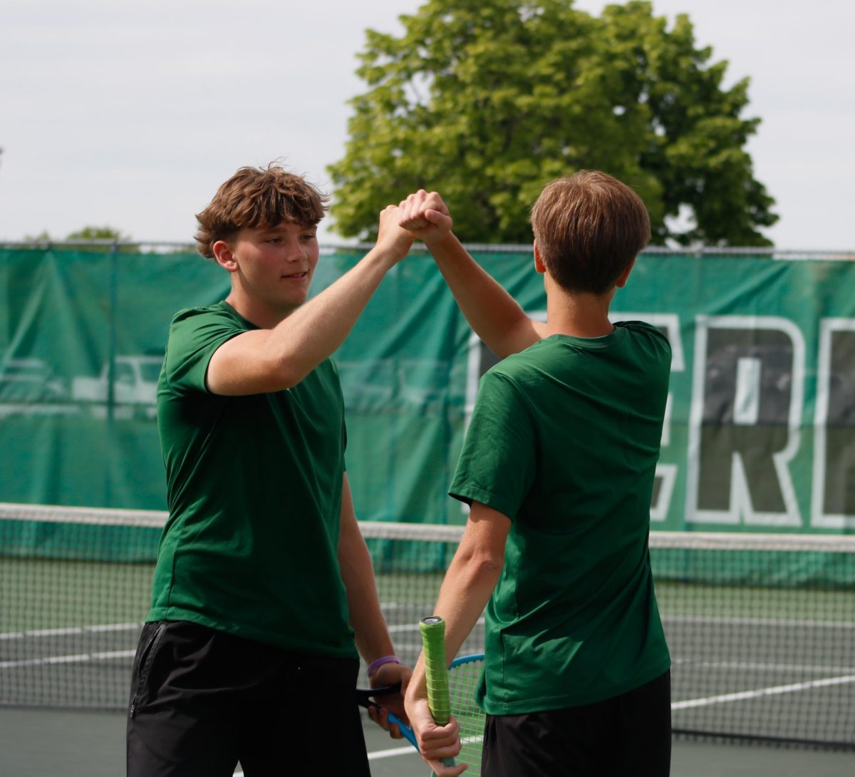 Juniors Landen Highsmith and Jayce Johnson celebrate a good play.