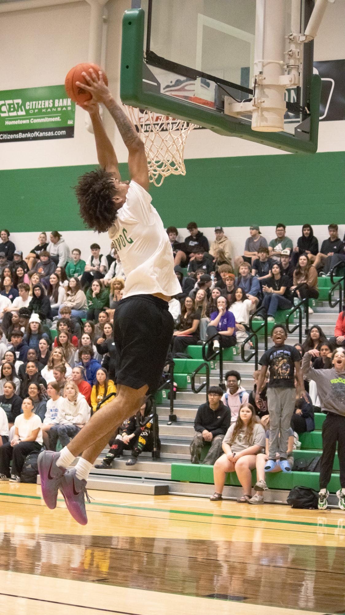 Seniors and staff play against each other in a basketball game