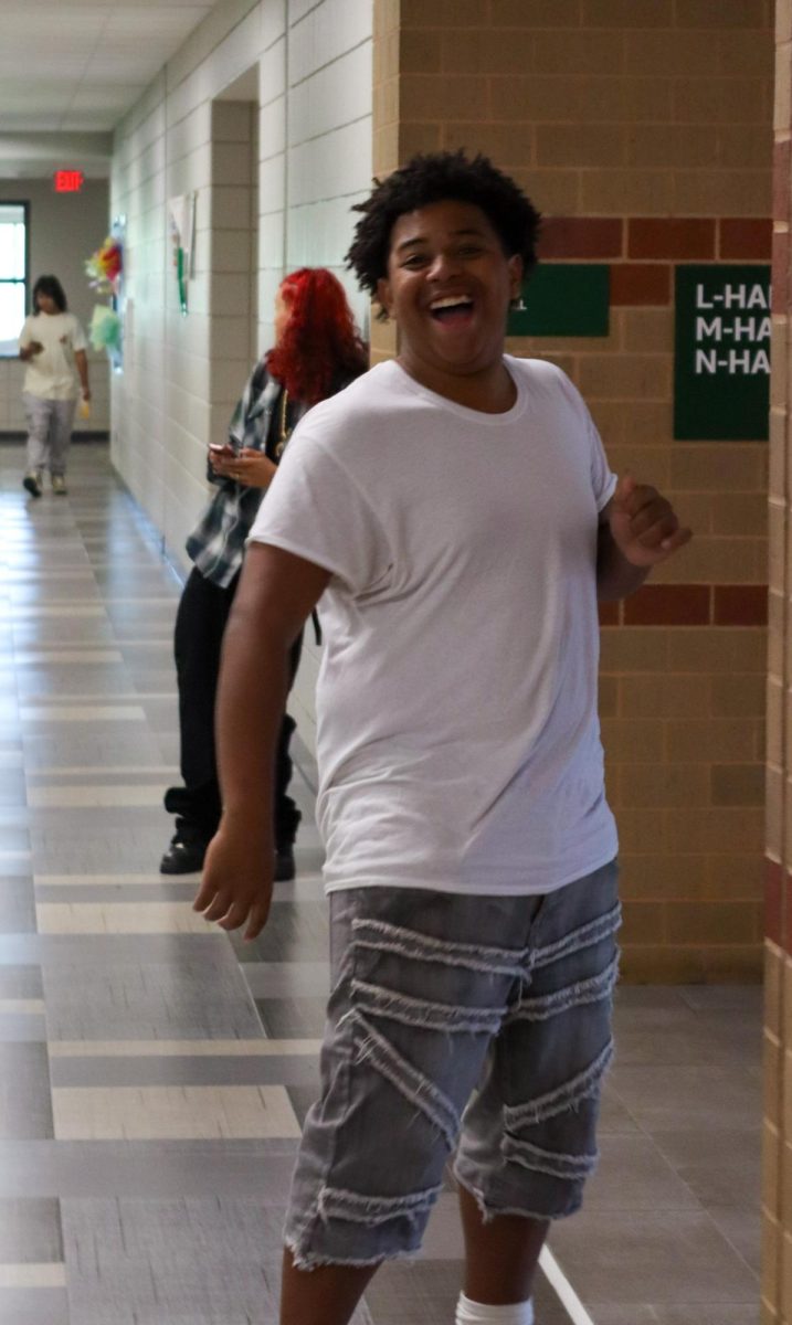 Students mingle as they walk in the halls.