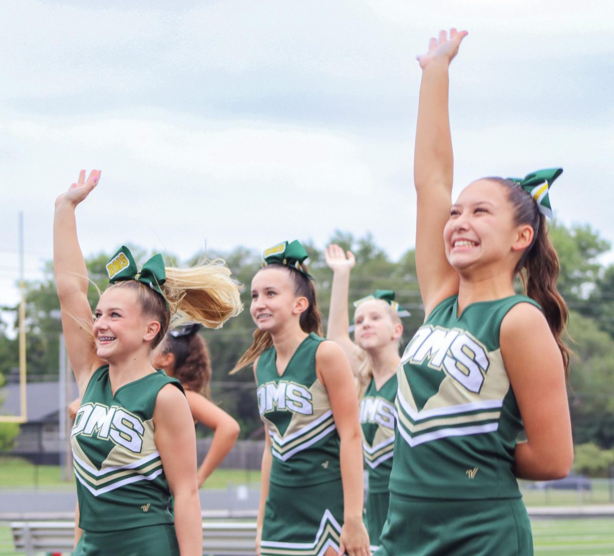 DMS cheerleaders wave.