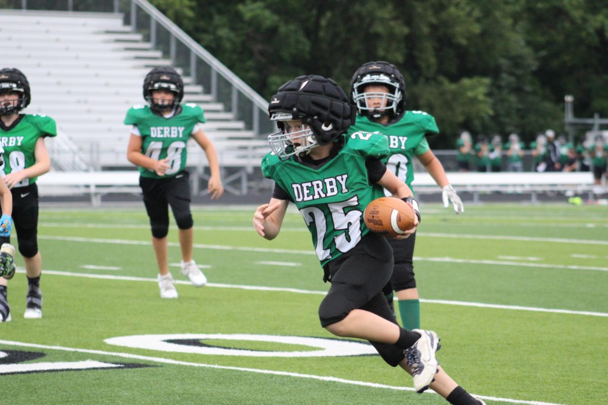 Derby player gaining ground with the ball. 