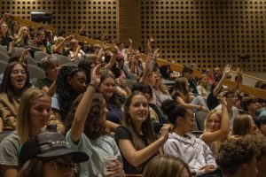 Derby North Middle School students raise their hands.